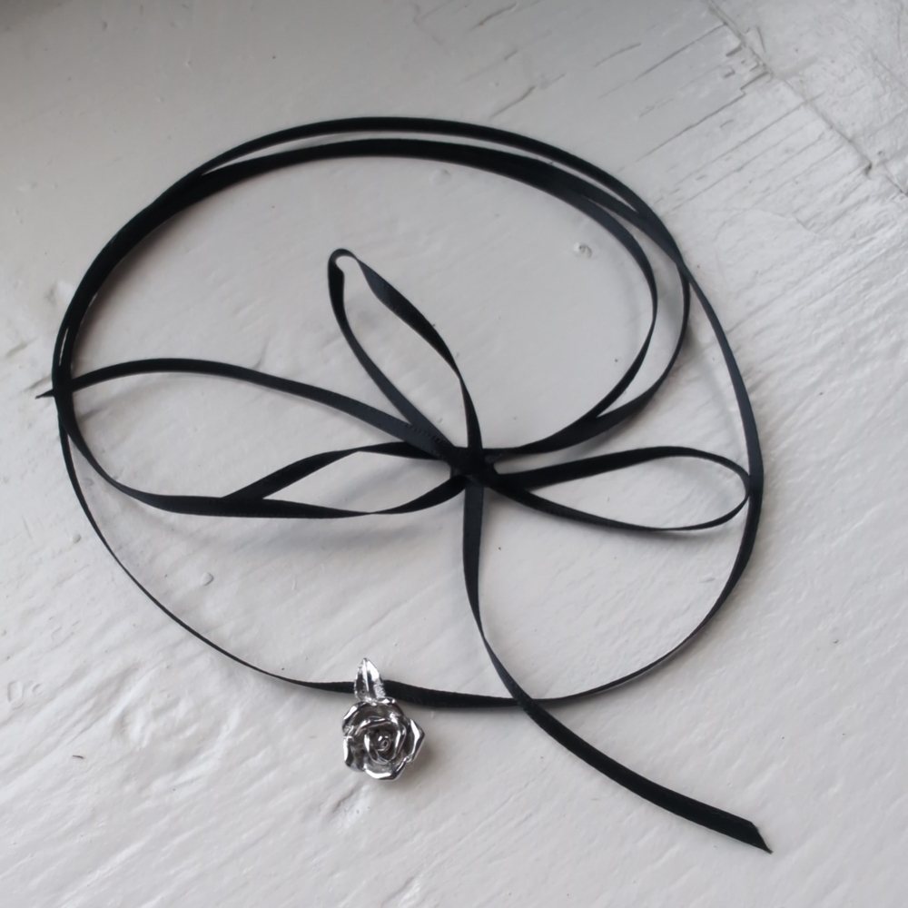 Black ribbon choker with pewter rose charm